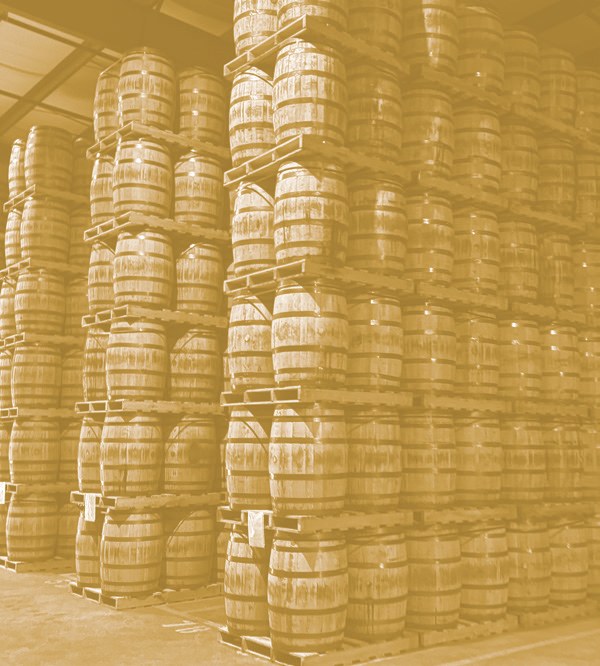 Barrels stacked inside an Extended Stave warehouse